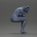 Crying girl sitting low in orange dress with head in hands - Only-Games