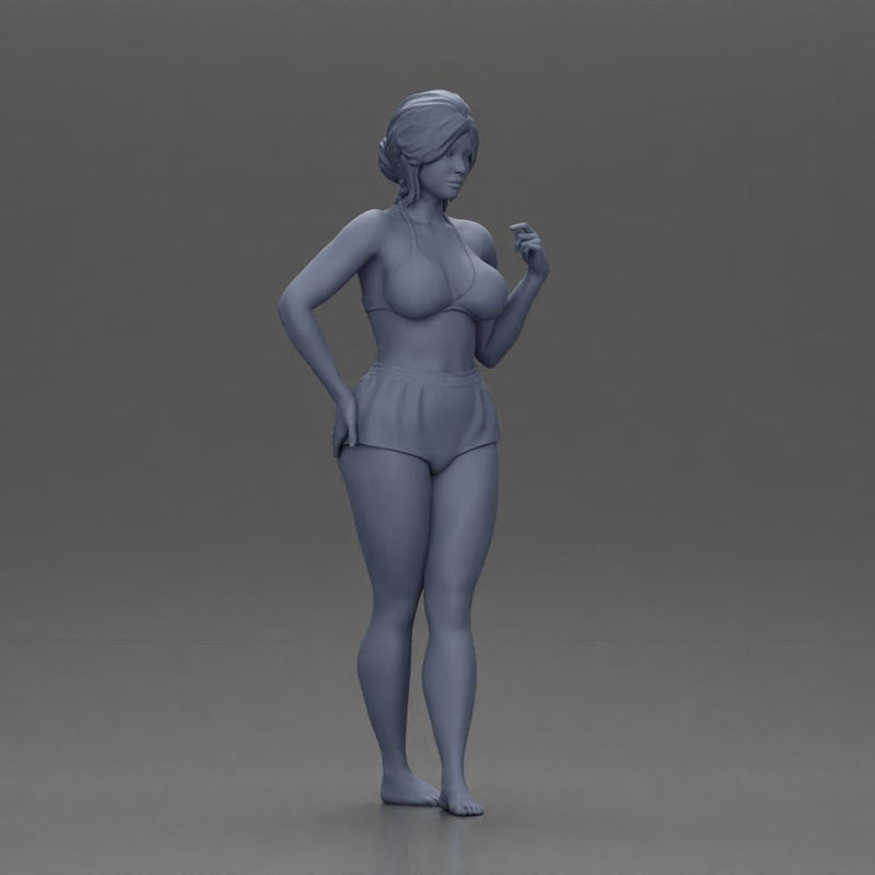 woman posing barefoot wearing bikini top and shorts stylishly - Only-Games
