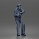 Senior Leaning On Cane Wearing Cap Suspenders Bow Tie Sneakers