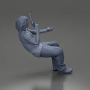 Man sitting with gun in hand pointing forward calmly - Only-Games