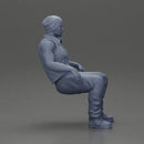 Muscular Bearded Man in Beanie Vest Pants Sitting Casually Relaxed - Only-Games