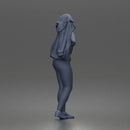 Woman Putting On Jacket Over Crop Tank And Leggings With Sneakers