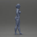 woman posing barefoot wearing bikini top and shorts stylishly - Only-Games