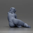 attractive woman in red swimsuit resting calmly on the beach - Only-Games