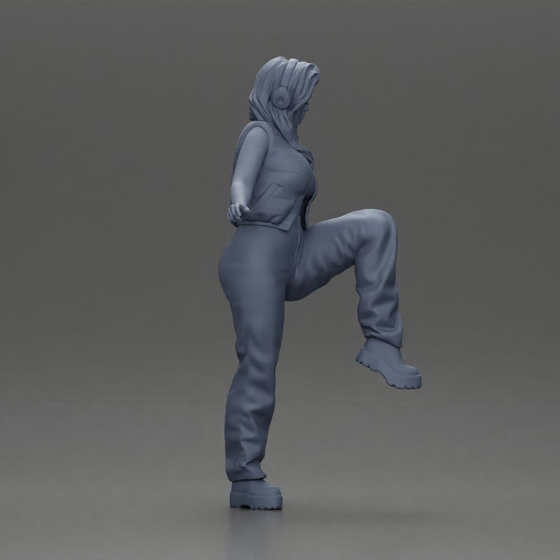 Woman in Headphones Lifting Leg in Stylish Streetwear - Only-Games