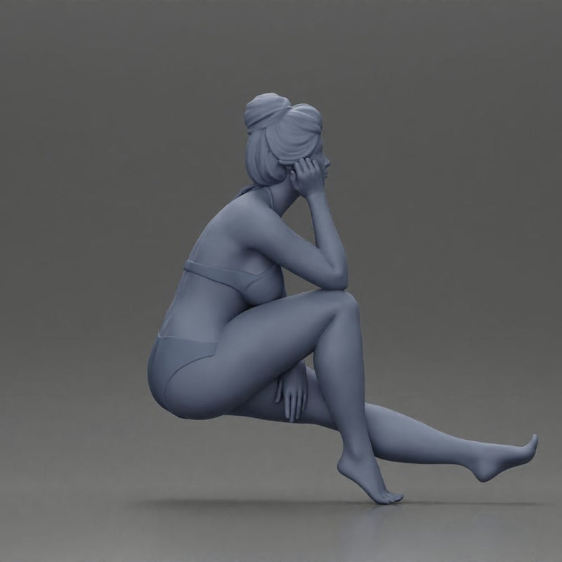 Woman sitting in Blue Bikini Ponders with Relaxed Posture - Only-Games