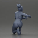 Fashionable woman kneeling in red jacket, green pants, and black boots - Only-Games