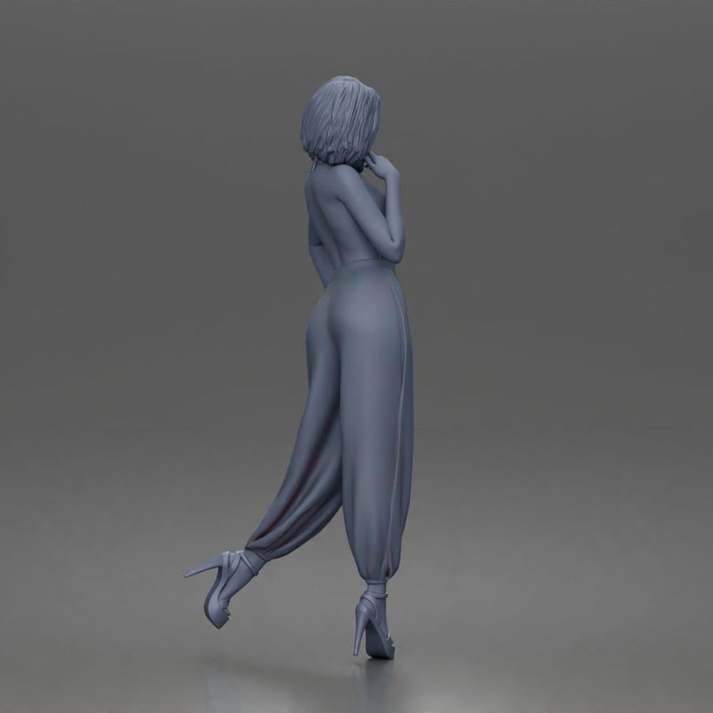 Woman poses thoughtfully lifting heel wearing halter jumpsuit with platform heels - Only-Games