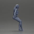 Stylish woman sitting casually in a white top and blue skirt - Only-Games