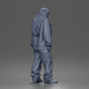 Girl Standing In Oversized Sweatshirt Cargo Pants And Sneakers