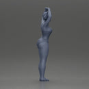 Brunette woman in turquoise swimsuit stretching with elegant ballet pose - Only-Games