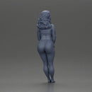 Woman in yellow top and red shorts leaning to wall - Only-Games