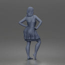 woman posing with hands on hips wearing ruffled dress