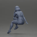 Confident Blonde Woman Sitting Gracefully in Red and Pink - Only-Games