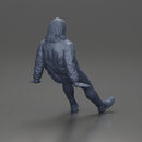 Man with long hair wearing brown jacket sitting with relaxed posture - Only-Games