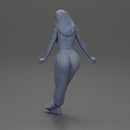 Woman sitting on car in red top yellow pants striking playful pose - Only-Games