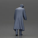 Man in black coat wearing flat cap standing with serious expression - Only-Games