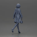 Woman with curly hair wearing red coat walking holding red handbag - Only-Games