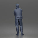 Man Standing Calmly in Casual Cardigan and Dress Pants