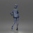 Elegant Woman Posing Confidently in Chic Jacket and Dress Outfit