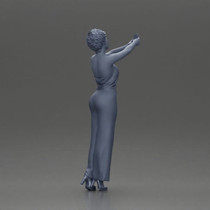 Fashionable woman in a jumpsuit snapping a selfie in style - Only-Games
