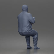 Asian Man sits gesturing while wearing casual sweater pants flip flops comfortably - Only-Games