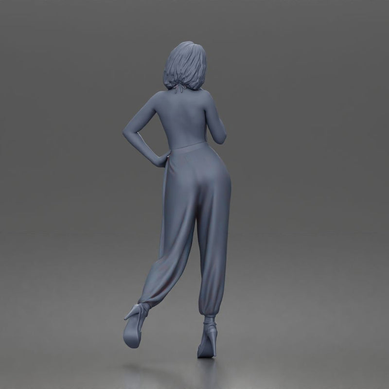 Woman poses thoughtfully lifting heel wearing halter jumpsuit with platform heels - Only-Games