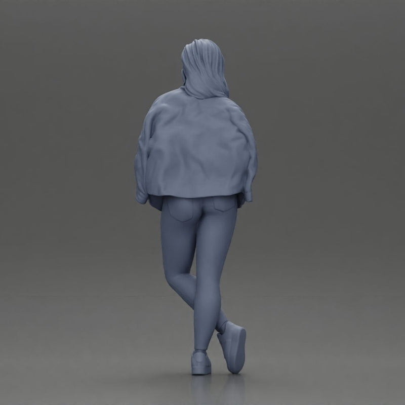 woman standing stylishly hands in pockets striking pose - Only-Games