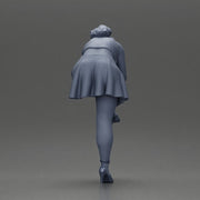 Young woman in skirt adjusts her elegant black high heeled shoes - Only-Games