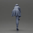 Young woman in skirt adjusts her elegant black high heeled shoes - Only-Games