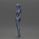 Woman in silver mini dress posing with hand on hip - Only-Games