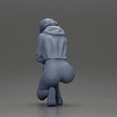 Performer crouching thoughtfully in yellow jacket green shorts white sneakers - Only-Games