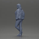 woman standing stylishly hands in pockets striking pose - Only-Games