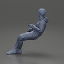 Casually sitting, holding a cup, enjoying a peaceful moment - Only-Games