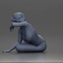 attractive woman in red swimsuit resting calmly on the beach - Only-Games