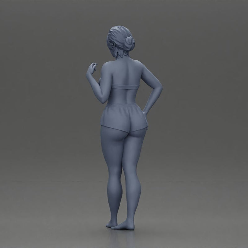 woman posing barefoot wearing bikini top and shorts stylishly - Only-Games