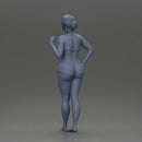 woman posing barefoot wearing bikini top and shorts stylishly - Only-Games