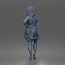 woman posing with hands on hips wearing ruffled dress