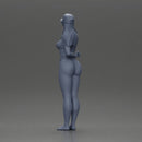 girl in a white bikini holding a phone on the beach and wearing a cap - Only-Games