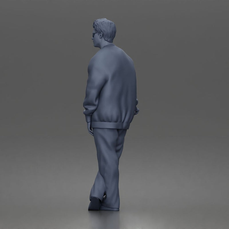 Man standing In Bomber Jacket Tee Trousers Sneakers And Sunglasses