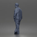 Man standing In Bomber Jacket Tee Trousers Sneakers And Sunglasses