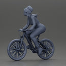 Sporty girl riding a red bike in bright yellow tracksuit - Only-Games