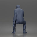 Seated Detective In Long Coat Holding Weapon In Contemplative Pose