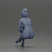 Woman sitting in Blue Bikini Ponders with Relaxed Posture - Only-Games