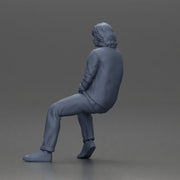 Man in Casual Sweater and Sneakers Sitting with Relaxed Posture - Only-Games