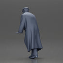 Man in black coat wearing flat cap standing with serious expression - Only-Games