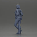 Confident woman leaning slightly with her hands in pockets - Only-Games