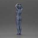 Brunette woman in turquoise swimsuit stretching with elegant ballet pose - Only-Games