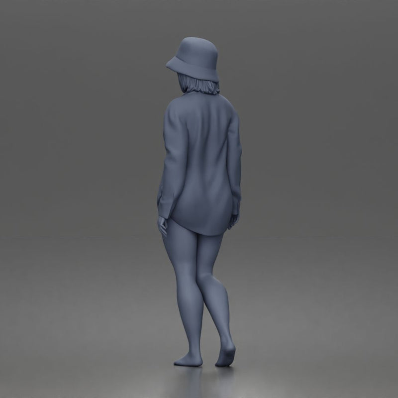 Standing woman In Oversized Button-Shirt With Bucket Hat Barefoot