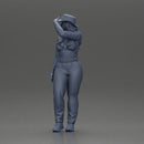 woman in red pants striking stylish pose with hat - Only-Games